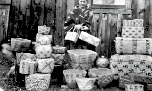 BC Archives # C-01165, Mrs. Frank Brokaw w. Indian Handicrafts, Mt. Currie, 1913